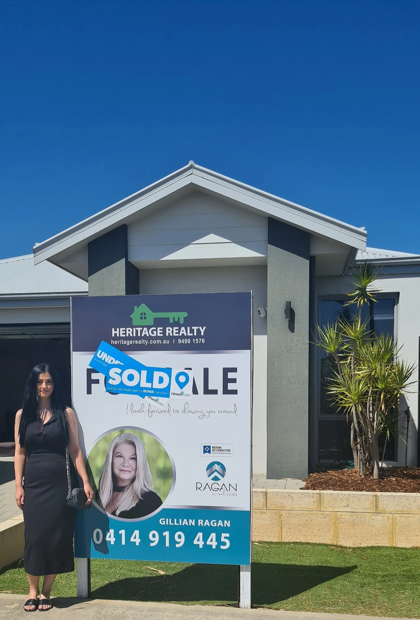 Celebrating a sold home with Heritage Realty